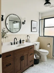 Cream wainscoting bathroom with black hardware design