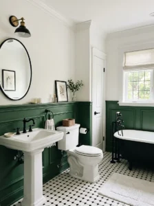 Green wainscoting bathroom with white walls and black fixtures