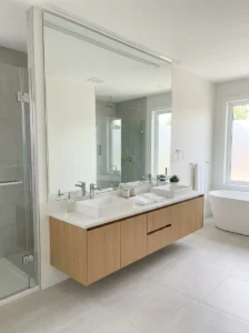 Full wall mirror in modern bathroom
