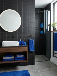 Black wall with blue decor bathroom