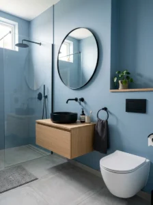 Soft blue walls with black fixtures