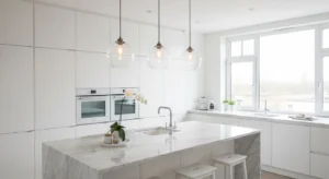 Minimal glass globe pendant lights over modern kitchen island