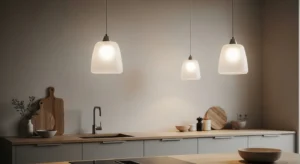 Frosted glass pendant lights creating soft lighting over kitchen island