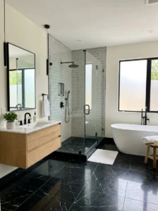 Black marble floor with light walls bathroom