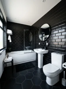 Black tile bathroom with white fixtures