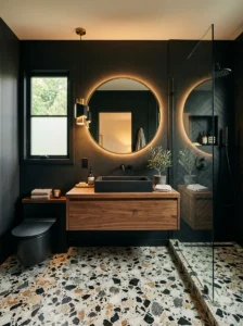Black bathroom featuring terrazzo flooring and minimalist decor