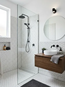 White hexagon tile bathroom with black accents