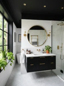 Black bathroom ceiling with matching black vanity and brass accents