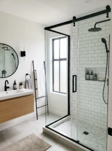 Matte black shower frame paired with white bathroom tiles for sleek contrast