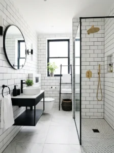 White subway bathroom tiles with dark grout and gold fixtures
