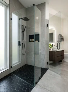 Black hexagon shower floor tiles adding texture and modern detail