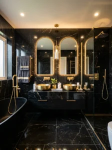 Black marble bathroom with gold hardware