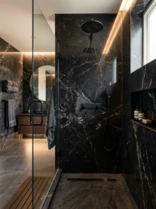 Black marble shower walls creating a luxurious bathroom design