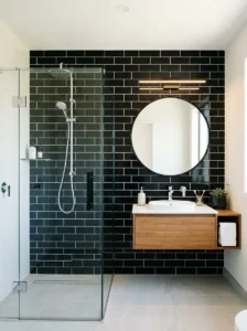 Black subway tiles with light grout creating a clean and structured bathroom look