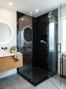 Black subway tile shower adding texture and modern contrast to bathroom