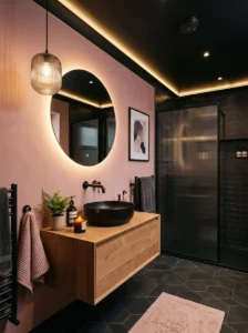 Dusty pink bathroom featuring a bold black ceiling