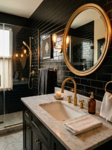 Black subway tile bathroom featuring gold fixtures