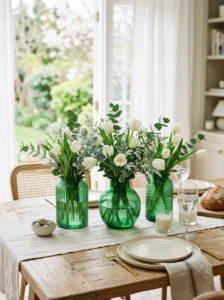 Green glass vases with fresh flowers for St. Patrick’s Day home decor