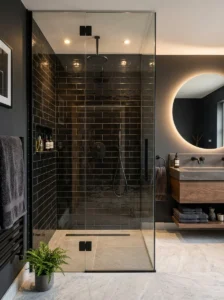 Glossy black shower tiles with modern lighting