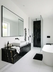 Minimal bathroom with black marble accents