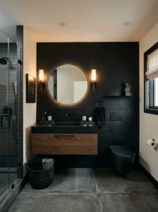 Black toilet with matching black accent wall in bathroom