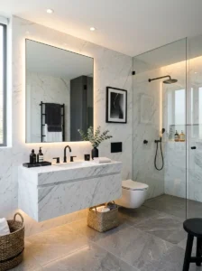 Premium modern bathroom with matte black fixtures, marble surfaces, and warm lighting