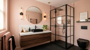 Stylish pink and black bathroom with matte black fixtures and blush walls