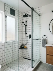 Shower wall tiles with black grout and modern fixtures