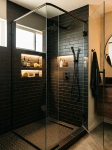 Black subway tile shower with built-in storage niches