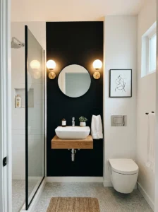 Small bathroom with black accent wall and light fixtures