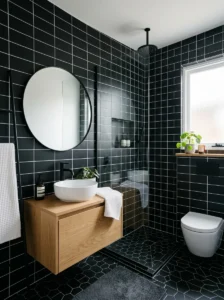 Black tile bathroom with white grout contrast