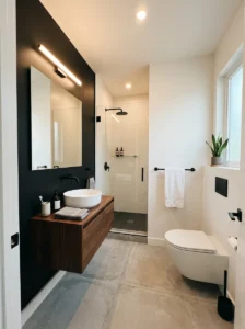 Small bathroom featuring one black accent wall and modern decor