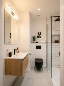 Small bathroom featuring a stylish black toilet