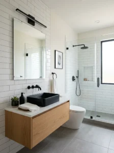 Black hardware standing out against glossy subway bathroom tiles