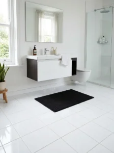 Black floor mat on white tile bathroom